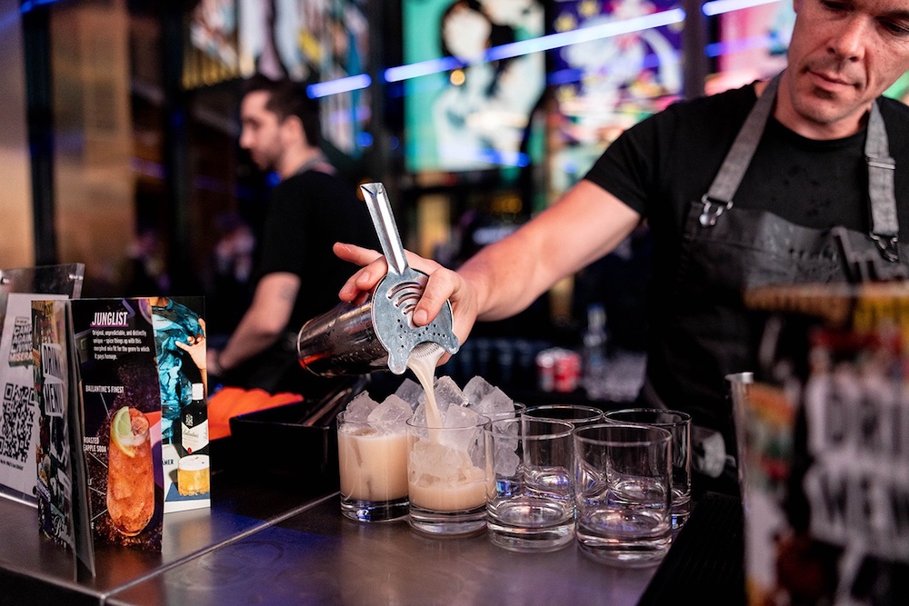 bartender serving cocktail at Mixmag party