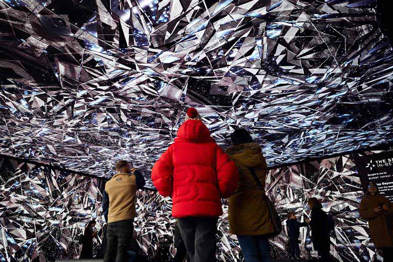 People looking at the Spaces In-Between immersive experience