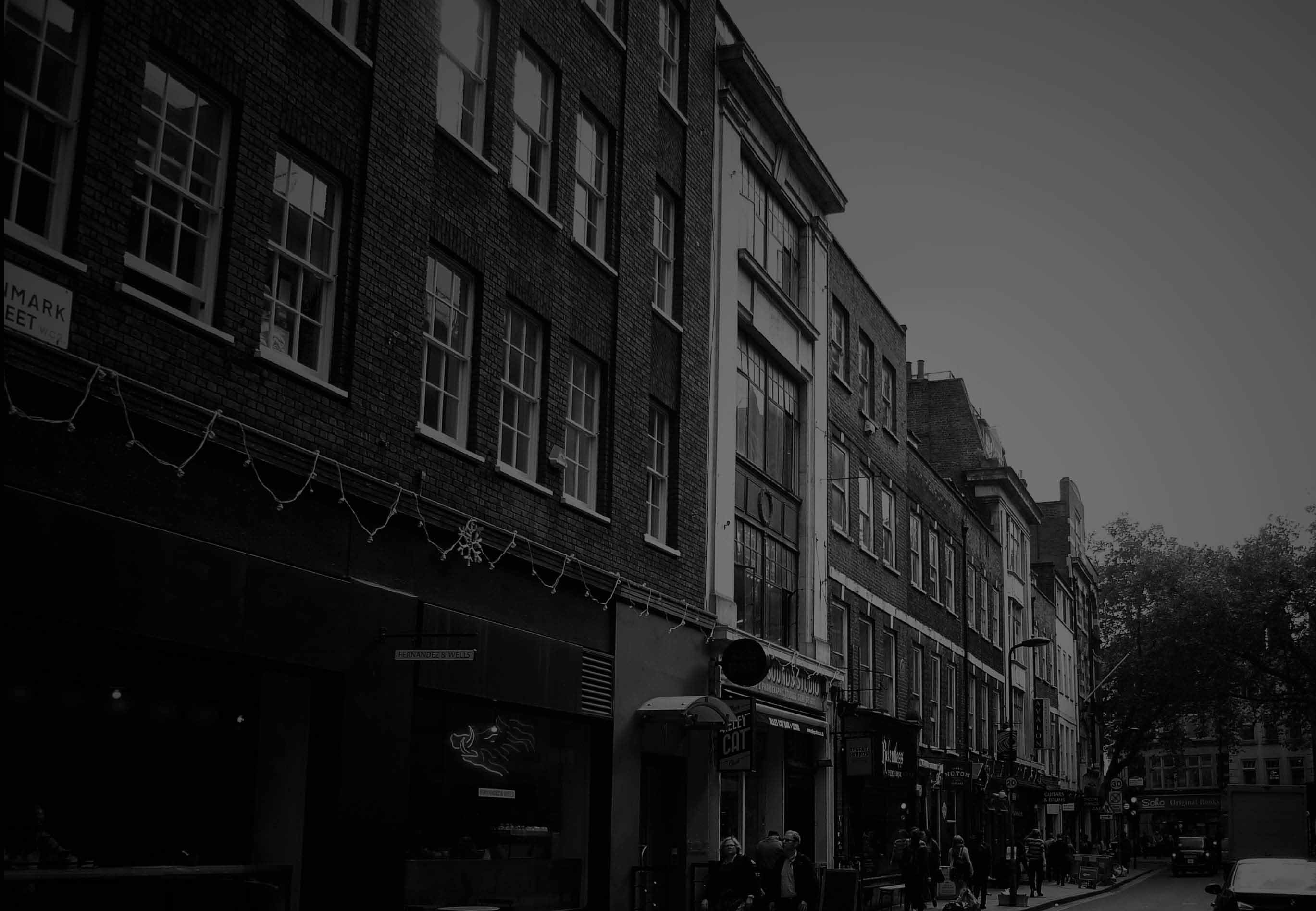 Grayscale photo of Denmark Street