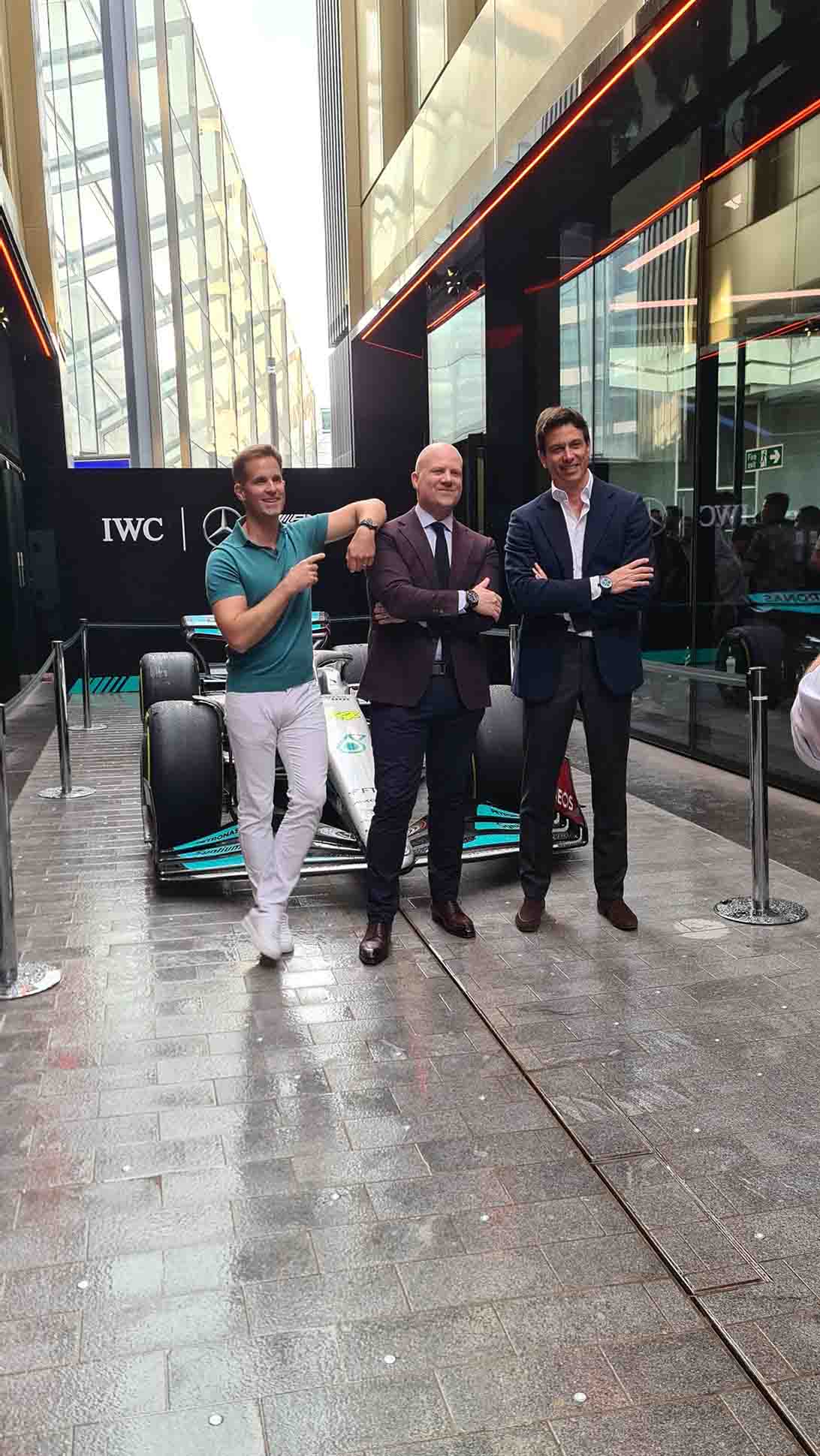 Toto Wolff and Chris Grainger-Herr standing in front of their Formula One car